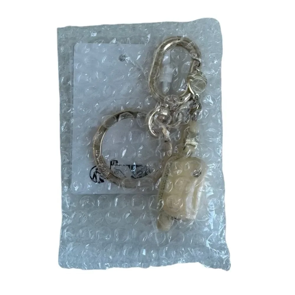 Everywhere Belt Bag Key Charm Butter Cream/Gold Key Charm